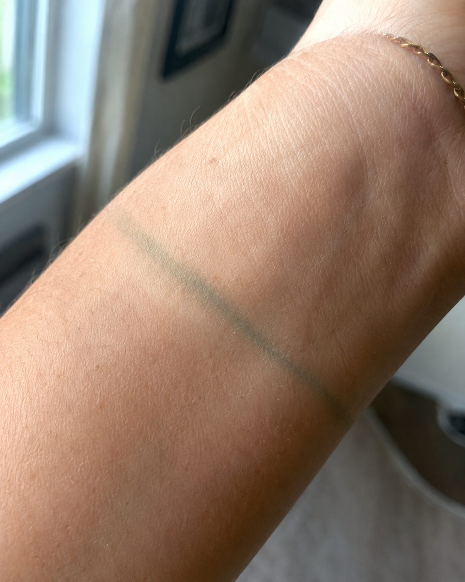 A faint green tarnish mark left on skin where plated jewellery sat